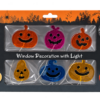 Zes gekleurde Halloween-pompoenen in verpakking